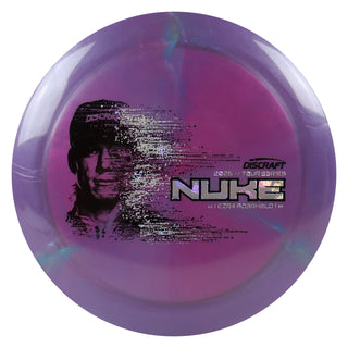 Discraft Disc Golf 2026 Ezra Aderhold Tour Series Nuke Purple Pink/Money Holo 175g