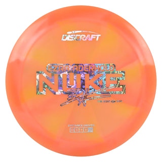 Discraft Disc Golf Ezra Aderhold 2025 Tour Series Z Swirl Nuke Driver 13/5/-1/3 Peach/Money Holo 173-174g
